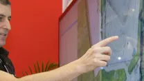 Chris Parker using an interactive display